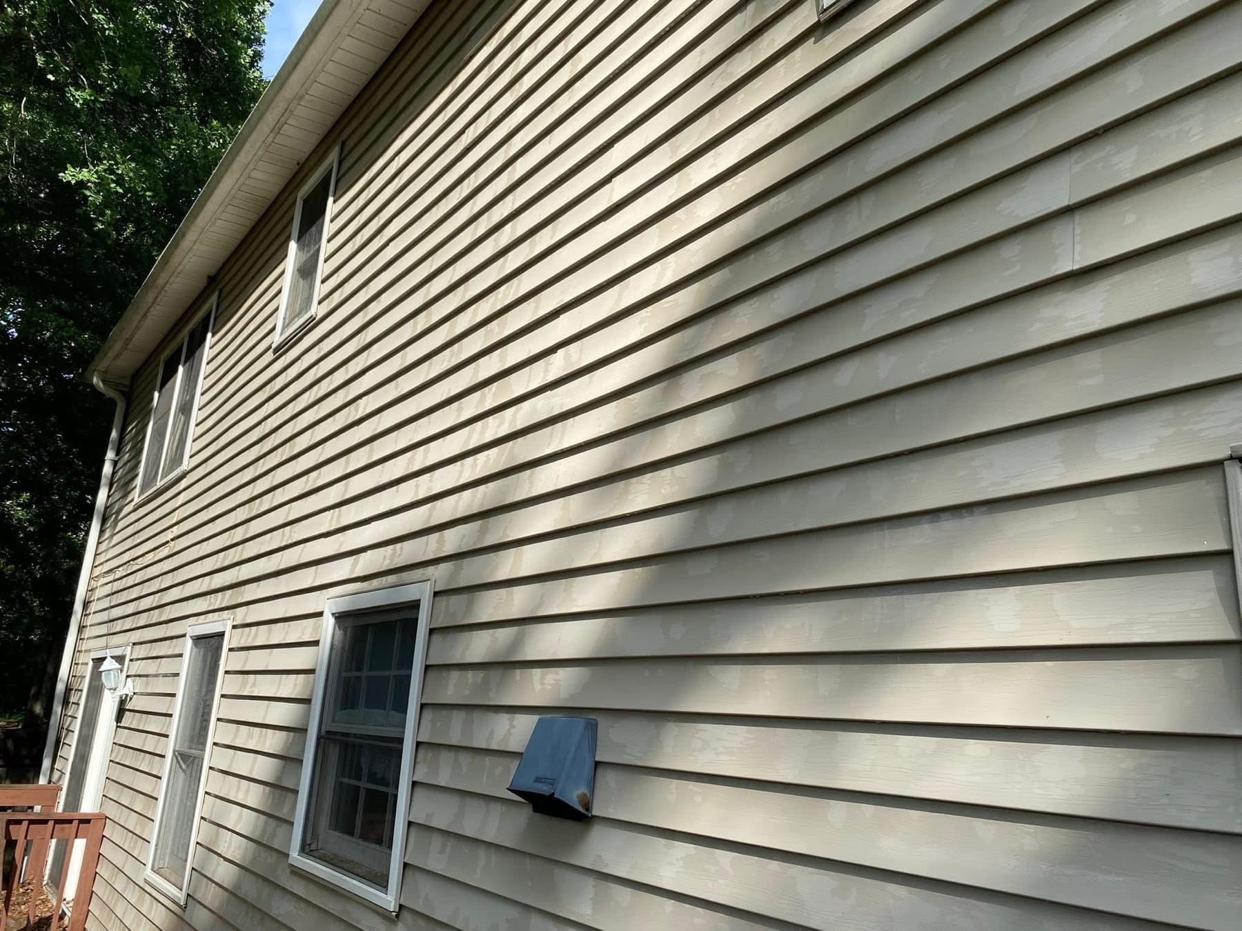 Siding and deck after an exterior wash