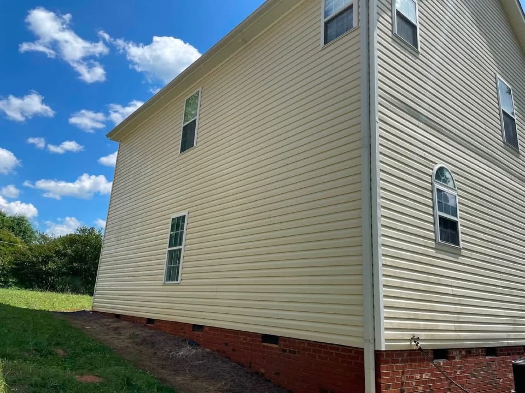 Side elevation of a home after a soft wash