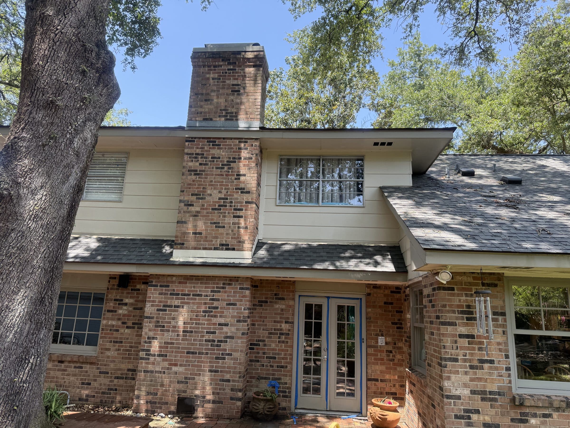 Two story brick home in Gretna with the trim and chimney cleaned
